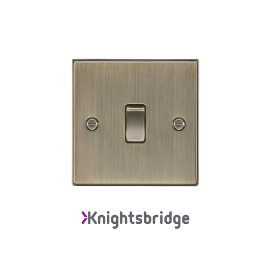 Brass light switch with 'Knightsbridge' branding on a white background