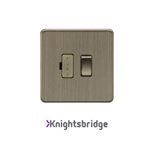 Brass light switch with fuse indicator on a white background, branded 'Knightsbridge'.
